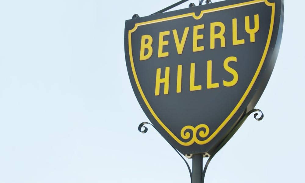 city of beverly hills sign with light blue sky