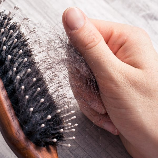 pulling hair out of a brush